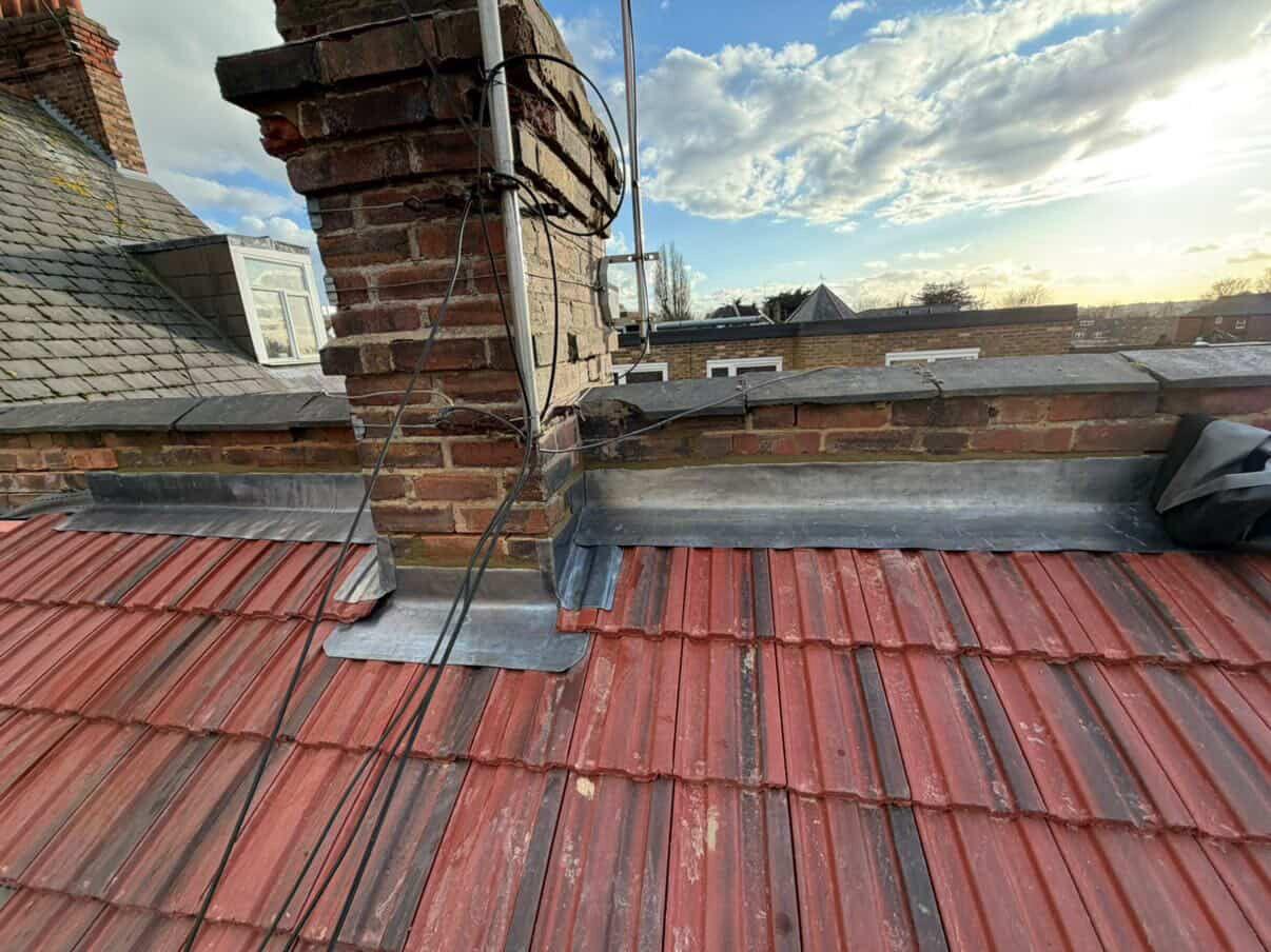 Chimney flashing and adjoining red roof tiles