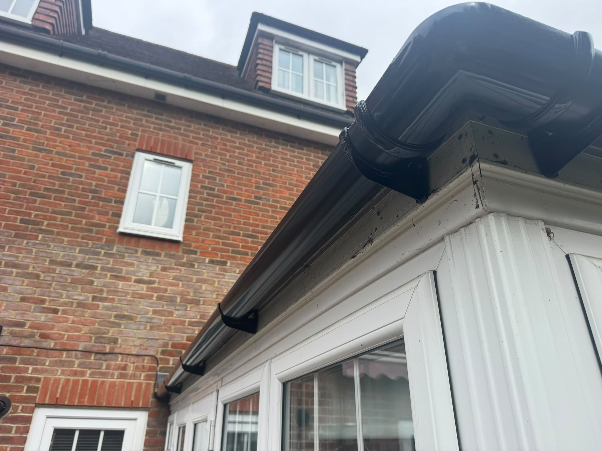 Roof edge, fascia and guttering above a window